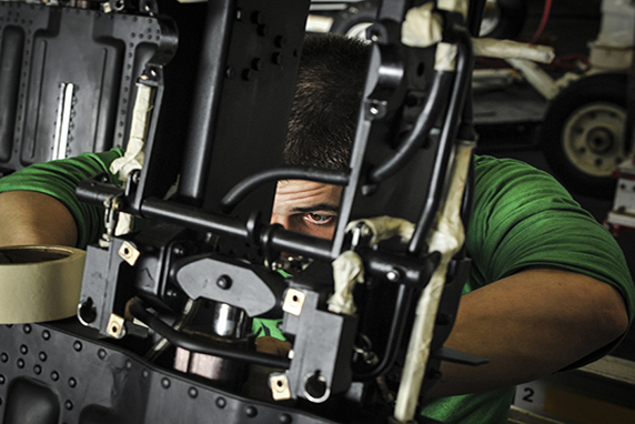 Sailors perform maintenance on ejection seats