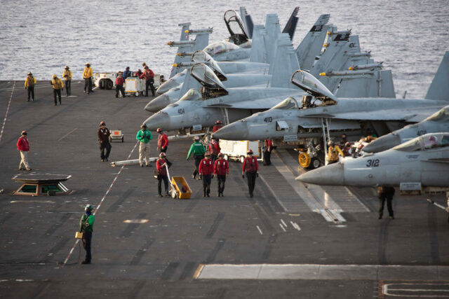 F/A-18 Super Hornets, attached to Carrier Air Wing (CVW) 8, prepare for flight operations on the flight deck of the world’s largest aircraft carrier USS Gerald R. Ford (CVN) 78 in the Mediterranean Sea, Nov. 6, 2023. The Gerald R. Ford Carrier Strike Group is currently operating in the Eastern Mediterranean Sea. The U.S. maintains forward-deployed, ready, and postured forces to deter aggression and support security and stability around the world. (U.S. Navy photo by Mass Communication Specialist 2nd Class Jennifer Newsome)